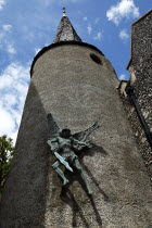 England, East Sussex, Lewes, High Street, St Michael's Church detail with sculpture of the Arcangel.