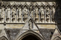 England, Wiltshire, Salisbury, Cathedral, Stone statues of Saints above the entrance.