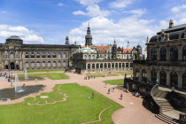 GERMANY, Saxony, Dresden, The central Courtyard of the restored Baroque Zwinger Palace gardens busy with tourists originally built between 1710 and 1732 after a design by Matthus Daniel Pppelmann in...