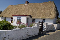 IRELAND, County Weford, Kilmore Quay, Thatched cottage in fishing village renowned for such dwellings.   