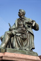 Poland, Wroclaw, seated statue of writer Alexander Fredo in the Rynek old town square.