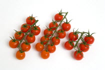 Food, Fruit, Tomato, Ripe red cherry tomatoes on the vine against a white background.