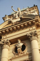 Poland, Krakow, female sculptures & male bust on the Juliusz Slowacki Theatre.