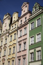 Poland, Wroclaw, pastel coloured building facades in the Rynek old town square.