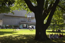 Ireland, North, Belfast, Botanic Gardens, Schoolchildresn sat in grounds outisde the Ulster Museum.