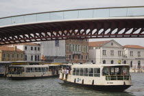 Italy, Veneto, Venice, Ponte di Calatrava Bridge, Fourth bridge across the Grand Canal opened September 2008 linking the train station and Piazzale. Passenger ferries below.