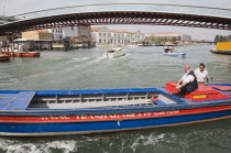 Italy, Veneto, Venice, Ponte di Calatrava Bridge, Fourth bridge across the Grand Canal opened in September 2008 linking the train station and Piazzale by Spanish architect Santiago Calatrava. Red and...