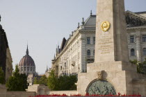 Hungary, Pest County, Budapest, WWII memorial with Hungarian Parliament Building behind.