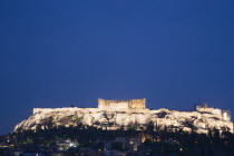 Greece, Attica, Athens, View towards the Acropolis illuminated at dusk.