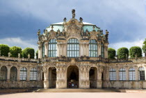 GERMANY, Saxony, Dresden, The Rampart Pavilion topped with a statue of Hercules in the restored Baroque Zwinger Palace gardens originally built between 1710 and 1732 after a design by Matthus Daniel...