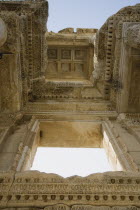 Turkey, Izmir Province, Selcuk, Ephesus, Roman Library of Celsus. View from below looking up at highly carved ceiling and window surround.