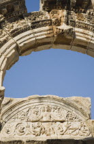 Turkey, Izmir Province, Selcuk, Ephesus, Detail of carved stone and arch in antique city of Ephesus on the Aegean sea coast. 