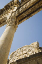 Turkey, Izmir Province, Selcuk, Ephesus, Detail of carved archway, supporting column and wall relief in antique city of Ephesus on the Aegean sea coast. 