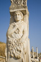 Turkey, Izmir Province, Selcuk, Ephesus, Detail of carved figure of Heracles or Hercules carrying the skin of the Nemean lion on pillar of the ruined Gate of Heracles.  