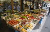 Austria, Vienna, The Naschmarkt, Display of fresh fruit and vegetables for sale outside shopfront.    