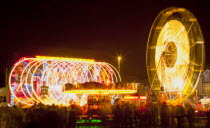 Entertainment, Funfairs, Rides, illuminated at night.