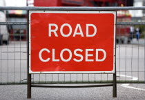 Transport, Road, Signs, Red Road Closed traffic sign on barrier across empty urban road in Bognor Regis.