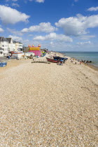 England, West Sussex, Bognor Regis, The beach pebble shingle and seafront with tourists.