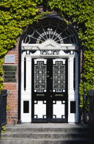 Ireland, County Dublin, Dublin City, Ornate black and white Georgian door in the city centre south of the Liffey River.