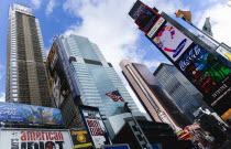 USA, New York, Manhattan, Times Square at the junction of 7th Avenue and Broadway below buildings with advertising on large video screens.