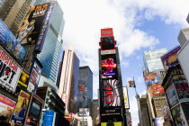 USA, New York, Manhattan, Skyscrapers in Times Square at the junction of 7th Avenue and Broadway below buildings with advertising on large video screens.