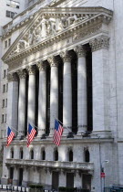 USA, New York, Manhattan, The New York Stock Exchange building in Broad Street beside Wall Street showing the main facade of the building featuring marble sculpture by John Quincy Adams Ward in the pe...