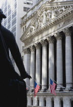 USA, New York, Manhattan, The New York Stock Exchange building in Broad Street beside Wall Street showing the main facade of the building featuring marble sculpture by John Quincy Adams Ward in the pe...