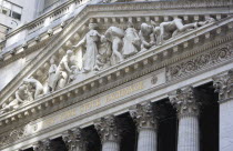 USA, New York, Manhattan, The New York Stock Exchange building in Broad Street beside Wall Street showing the main facade of the building featuring marble sculpture by John Quincy Adams Ward in the pe...