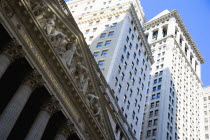 USA, New York, Manhattan, The New York Stock Exchange building in Broad Street beside Wall Street showing the main facade of the building featuring marble sculpture by John Quincy Adams Ward in the pe...