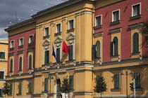 Albania, Tirane, Tirana. Pink and yellow exterior facades of government buildings on Skanderbeg Square.