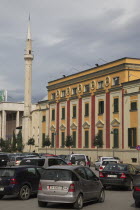 Albania, Tirane, Tirana. Congested traffic in front of government buildings and the Ethem Bey Mosque on Skanderbeg Square.