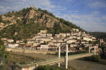 Albania, Berat, Traditional Ottoman buildings and footbridge over the river Osum.