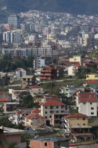 Albania, Tirane, Tirana, view across residential buildings to the hillside beyond.