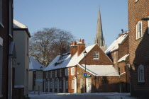 England, West Sussex, Chichester, street scene and the Cathedral in snow.