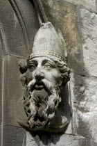 Ireland, Dublin, Detail of carved stgone face depicting a bearded man wearing a bishops mitre headdress.