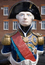 ENGLAND, Hampshire, Portsmouth, Ship's figurehead of Admiral Lord Nelson in the Historic Naval Dockyard.