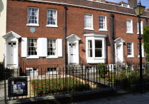 England, Hampshire, Portsmouth, The Charles Dickens Birthplace Museum in Old Commercial Road where he was born in 1812 and lived for three years commemorated with a blue plaque.