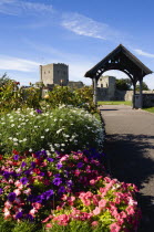 ENGLAND, Hampshire, Portsmouth, Portchester Castle. The 12th Century Norman tower and 14th Century Keep in the old Roman 3rd Century Saxon Shore Fort seen from the grounds of the Norman Ausgustine Pri...