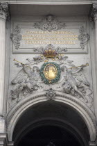 Austria, Vienna, Inscription & sculpted figures above the Michaelertrakt gateway to the Hofburg Palace.