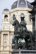 Austria, Vienna, Statue on Maria Therisia Platz with the Natural History Museum in the background.