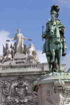 Portugal, Lisbon, Statue of King Jose 1 & the Triumph Arch in Praca do Comercio.