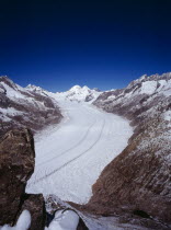 Switzerland, Valais, Aletsch Glacier, Grosser Aletschgletscher. View from Eggishorn towards skyline peaks of from left to right Dreieckhorn Jungfrau Monch Trugberg Eiger and Wannenhorn.