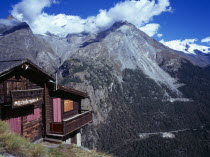 Switzerland, Zermatt, Mattertal, View towards west side of snow topped peak of Dom and Taschhorn mountains from Schaferhuttli chalet in foreground.