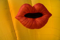 USA, New Mexico, Albuquerque, Annual balloon fiesta, Colourful yellow hot air balloon with red lips.