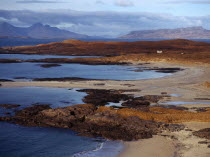 Scotland, Highlands, Ardnamurchan, Sanna Bay with, from left to right the Isle of Rum and Isle of Eigg beyond.