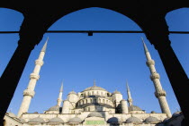 Turkey, Istanbul, Sultanahmet Camii, The Blue Mosque domes seen from the Courtyard with Arabic text from the Koran.