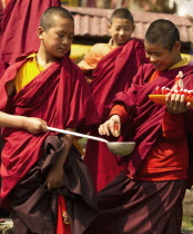 India, Sikkim, Buddhist Monks in a Losar ceremony.