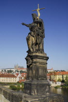 Czech Republic, Bohemia, Prague, Charles Bridge, Statue of John the Baptist with St Vitus.