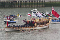 England, London, Rowers aboard Gloriana proceed along River Thames as part of the Queens Thames Diamond Jubilee Pageant, taken from Tower Bridge, 3rd June 2012.