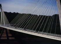 France, Bretagne, Finistere, Ile de Crozon. the new pont de terenez suspension bridge opened april 2011. from hillside above the river aulne showing suspension supports. view south.